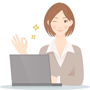 A woman showing OK gesture by a laptop